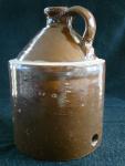 Chicken Waterer, 2 piece, top only, stoneware, molded, hand-formed handle and top, brown glaze, unglazed band at shoulder.